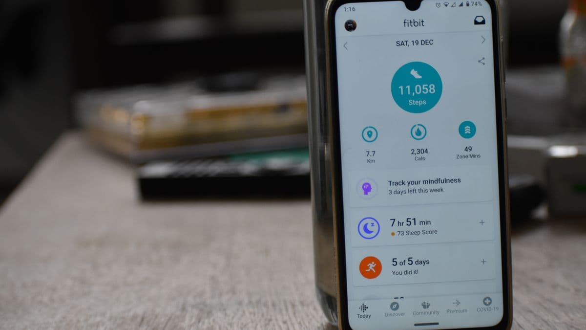A phone showing a fitness app with the day's step count